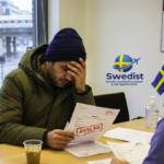 A person receiving a rejected asylum decision at a Swedish Migration Agency office in Stockholm.
